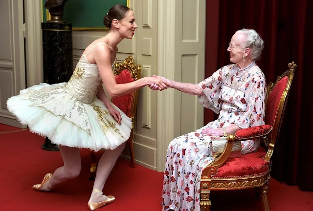 Queen Margrethe wore a floral print silk and tulle maxi dress. First Lady of Ukraine Olena Zelenska. Pearl earring and pearl necklace