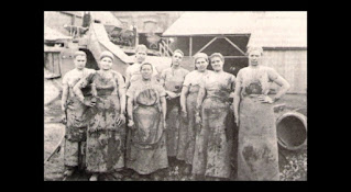 Old photograph of a team of a female work team
