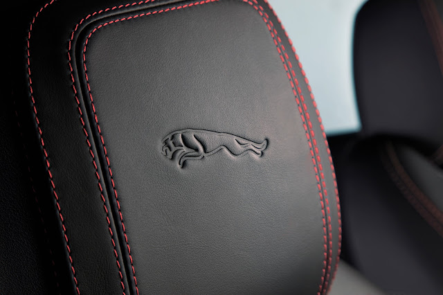 The Jaguar's headrest logo is surrounded by red seams in the new E-PACE.