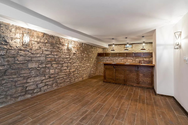 Wine or bar room with stone walls and bar