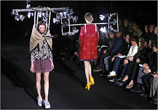 Viktor & Rolf fashion show Models wear lighting grids