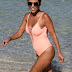 Kardashian puts her butt on show in a thong bathing suit in Miami - Photos
