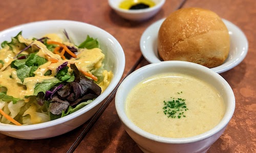 Combo items served before the main plate including salad, soup, and bread