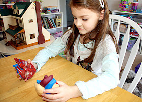 Tessa was instantly captivated by the Learning Resource heart model. She quickly memorized the path of blood flow through the heart and body and then passionately regurgitated the information to anyone who would listen. As with the brain model that we examined earlier this school year, she cabbaged onto the heart and it became her favorite "toy" playmate for a couple of days. She even made it a special place to sleep next to her pillow at night!