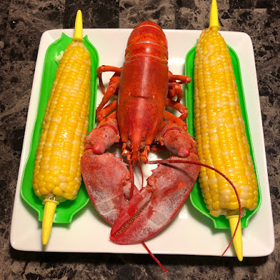 Steamed Maine lobster and corn on the cob