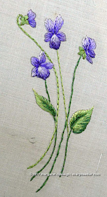 Society Silk Violets: a completed embroidered violet motif in antique silk floss