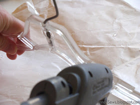 apply hot glue to a hanger's arm to add grip