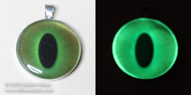 Resin cat's eye pendant in daylight and glowing in the night