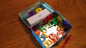 Magnetic letters in a mini lunchbox tin