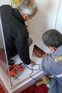 Later on, cutting out the damaged shower tray