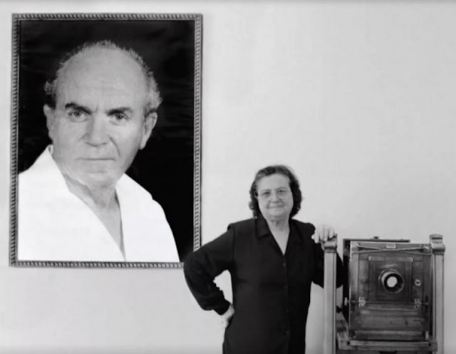 Drita Veseli in the picture with her husband's portrait Refik Veseli