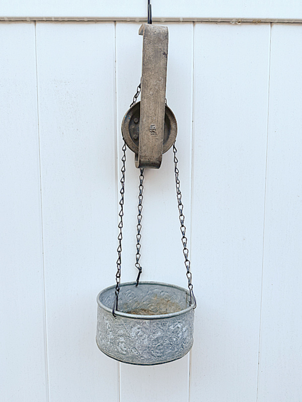 pulley on fence with planter