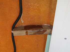 wood brace fiberglassed to a trailer shell