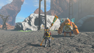 Link and Yunobo standing next to each other in front of a skull dome