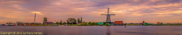 Sunset view of the river Zaan and windmill De Bonte Hen