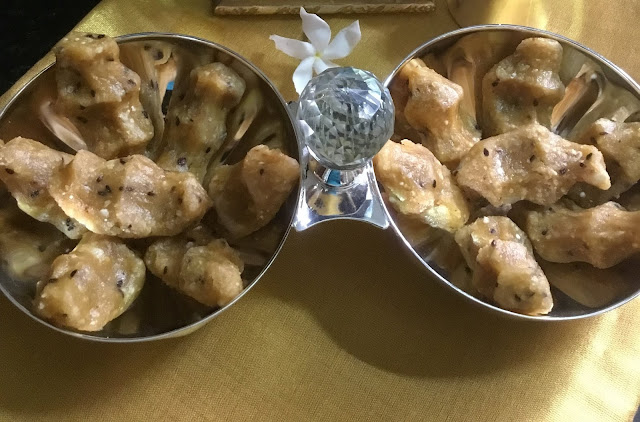 Sweet Pidi Kozhukattai | Rice Dumplings with Jaggery - Sweet Pidi Kozhukkatai - a classic prasadam recipe for pooja made with raw rice, jaggery, coconut, moong dal and black sesame seeds. This Pidi Kozhukkatai is a popular kozhukattai dish with different variations, although the most common method is prepared with the freshly prepared homemade rice flour as we do for maa vilakku. As I said in my previous posts, the coconut adds a great flavour to the jaggery based desserts.