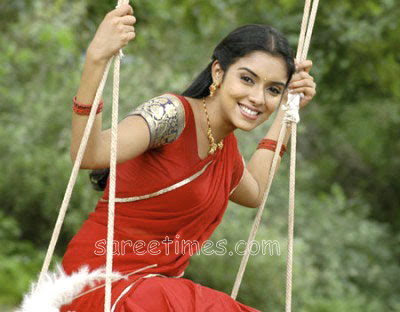 Bollywood and South Indian actress Asin in beautiful red half sari with thin 