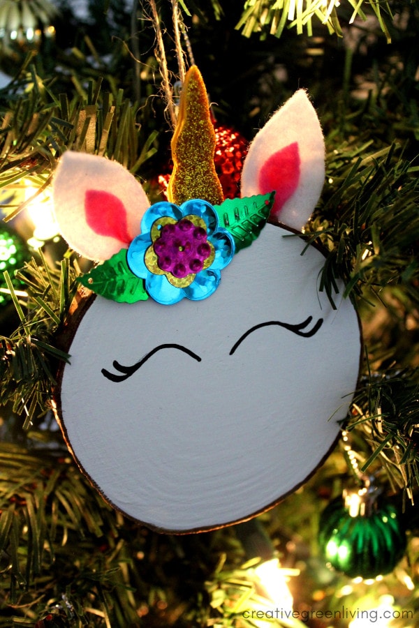 Unicorn christmas ornament made from a wood slice