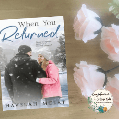 a wooden table with the book when you returned by Havelah McLat next to a bunch of peach roses.