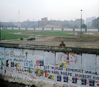 Berlin Wall, eastgerman border guard looks at the Kubat-Dreieck, July 1st 1988