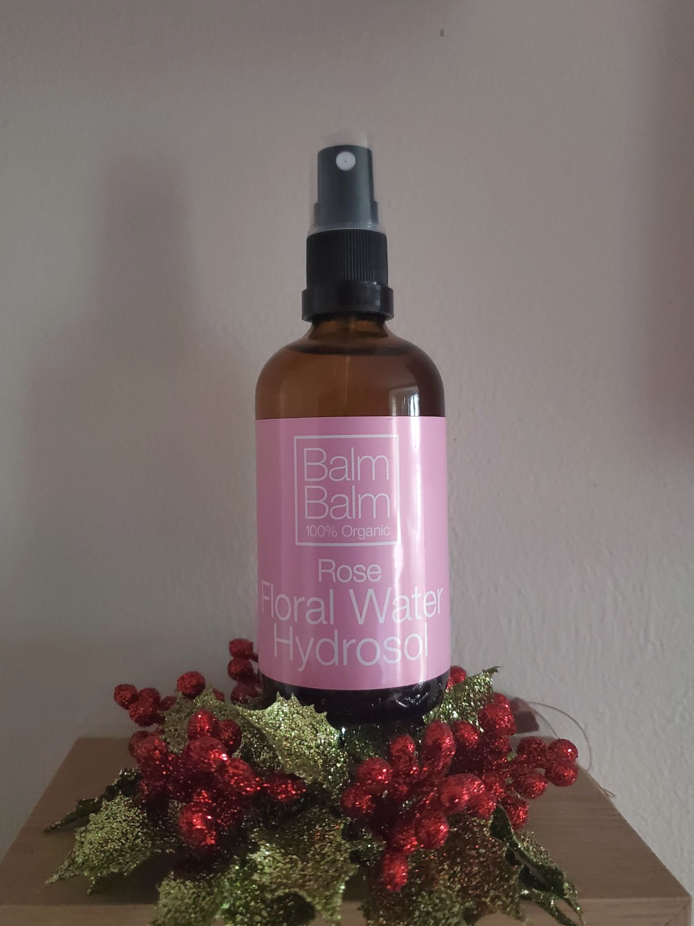 Balm Balm Rose Floral Water Hydrosol on top of festive decoration