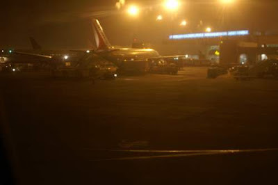 Image of plane taxing into resting place on the runway in Mumbai, India.