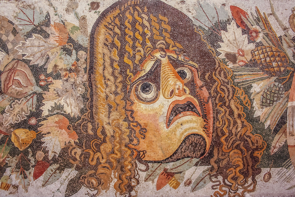 The mosaic with tragic mask from the House of the Faun of Pompeii