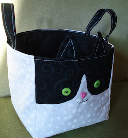 fabric bucket with a tuxedo cat design