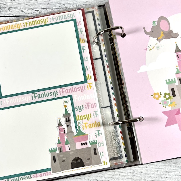 Disney scrapbook album page with castle and flying elephant