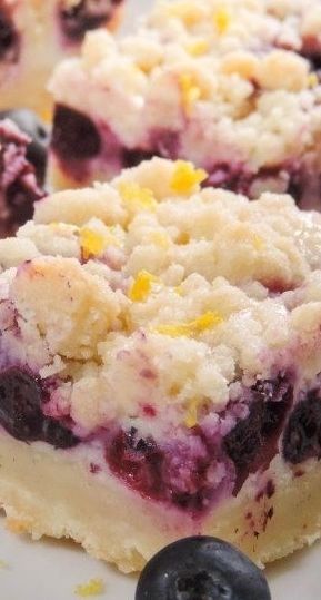Blueberry Lemon Pie Bars ~ Creamy and sweet pie bursting with blueberries and citrusy lemon on top of shortbread crust. In portable bar form!