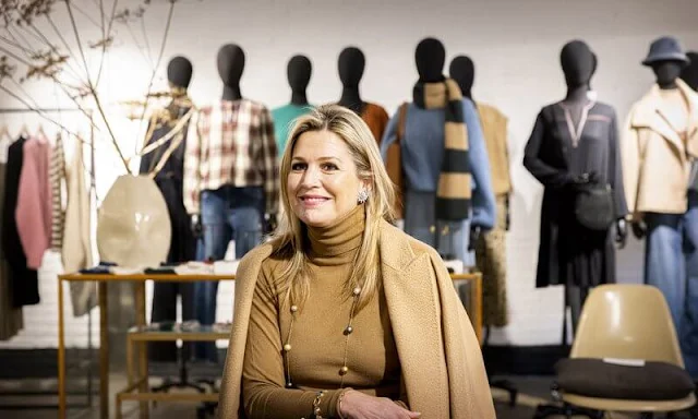 Queen Maxima wore a wool midi skirt and sweater by Massimo Dutti, and a megaton camel hair-wrap coat by MaxMara