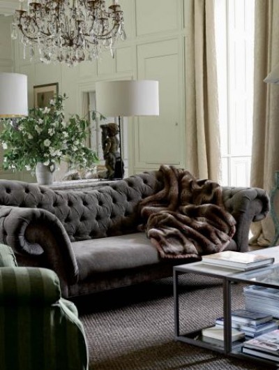gray velvet tufted couch sofa with mirrored wall