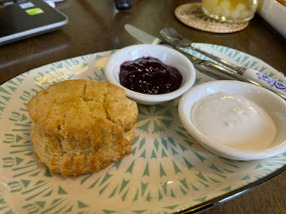 Freshly baked scones at Belinjo Cafe, served warm with jam and cream—a perfect treat to pair with coffee or tea