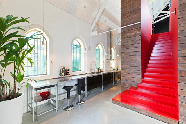 Picture of the kitchen and red staircase to the mezzanine floor