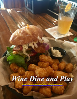 The southerner burger with fried green tomatoes, coleslaw, bacon and sriracha aioli at Punky's Bar and Grill and LGBT friendly restaurant in St. Petersburg, Florida