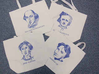 A photo of the front of the totes with each novelist showing.