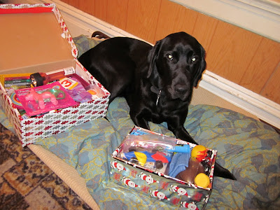 DAgan on his bed with the loaded boxes