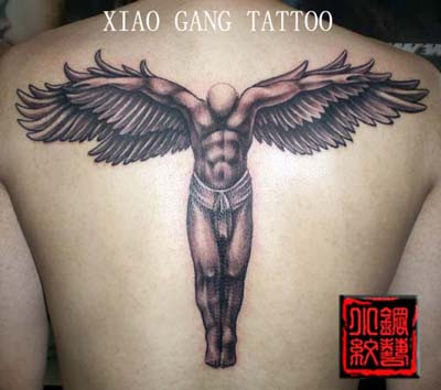 This free tattoo shows an unusually muscular angel which is not common