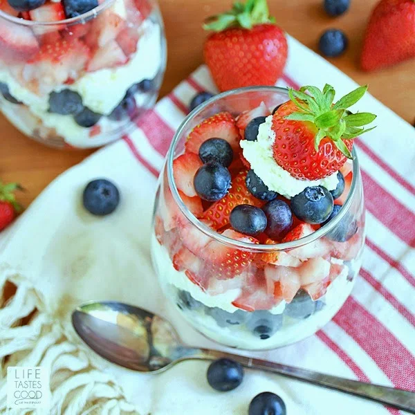 Red, White, and Blue Parfaits | by Life Tastes Good make the perfect dessert for our holiday weekend. The patriotic colors bring that festive feel, and because these parfaits are made with less carbs, we can enjoy this tasty holiday treat without all the guilt! #SundaySupper