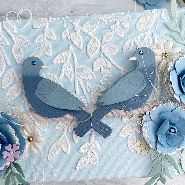 Mixed media canvas created with Sizzix Expand Paste and Sweet Birds Die with Prima Marketing paper flowers.