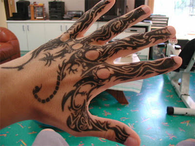 Detailed Tribal Hand Tattoo