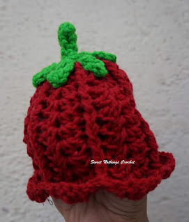 front view of the full red crochet preemie flower cap