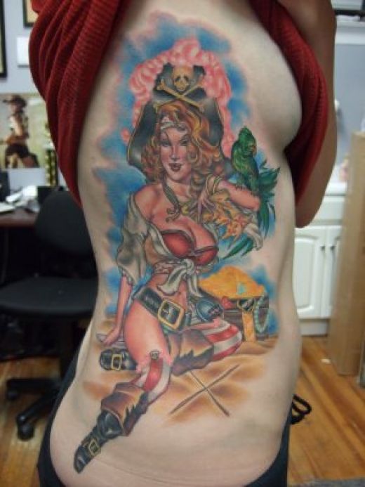 Pirate girl tattoo with parrot and treasure chest.