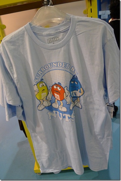 surrounded by Nuts M&M baby blue tee