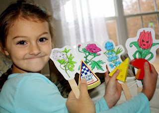 Tessa and I acted out "Lupe's Story" with Flower Friends craft stick puppets. Tessa loved this part of earning Lupe's petal. It was her idea to use her wooden cheese as props.