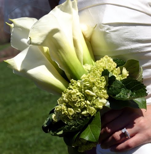 Pure white and traditional calla lilies wedding bouquet wrapped in white 