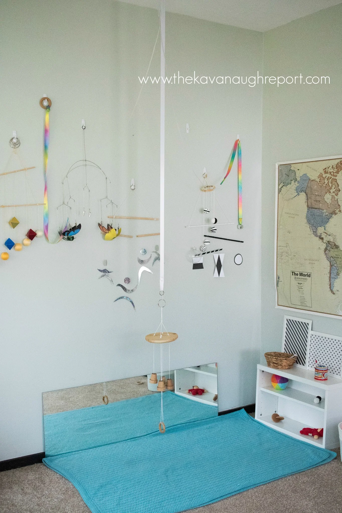 A movement area for a Montessori baby that can move! As a baby starts to roll, some changes need to be made to accommodate play and exploration.