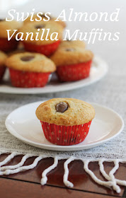 Food Lust People Love: Fluffy rich vanilla muffins are studded with chocolate covered almonds in these Swiss almond vanilla muffins which I created to match the flavors of my husband’s favorite Häagen-Dazs ice cream.