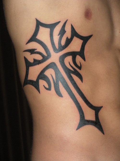 Black ink Cross Tattoo on Guys Ribs