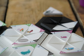 Plastic hexagons with insets where paper triangles with designs on them are placed.